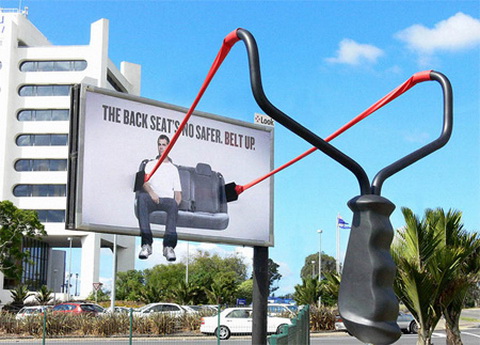 Billboard - Slingshot (The back seat is NO safer. Buckle up!)
